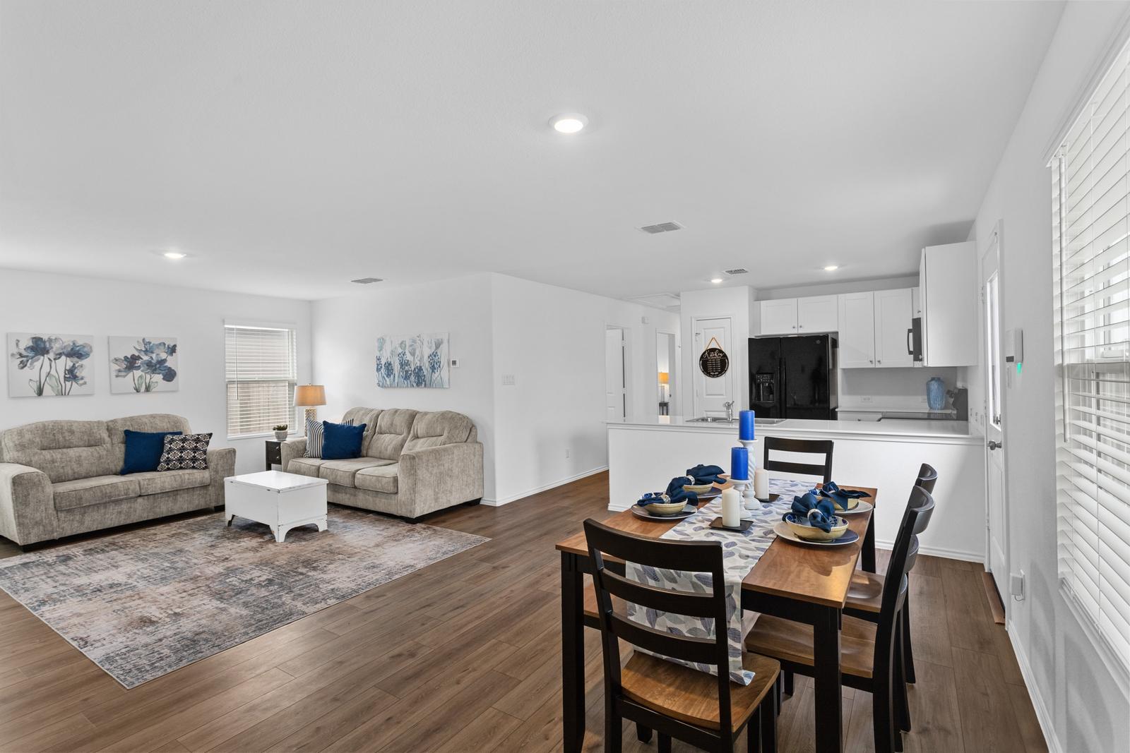 Open living and dining area next to the kitchen